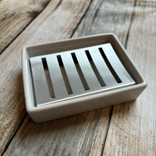 White ceramic soap dish with stainless integral drainer